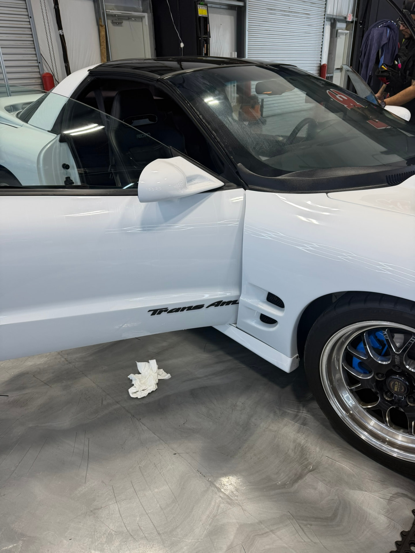White Trans Am with dark carbon window tint installed at our Magnolia TX shop