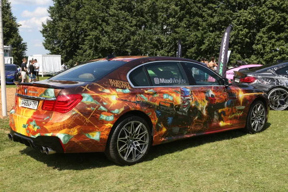 Sedan finished with a full printed vinyl wrap and branded lettering