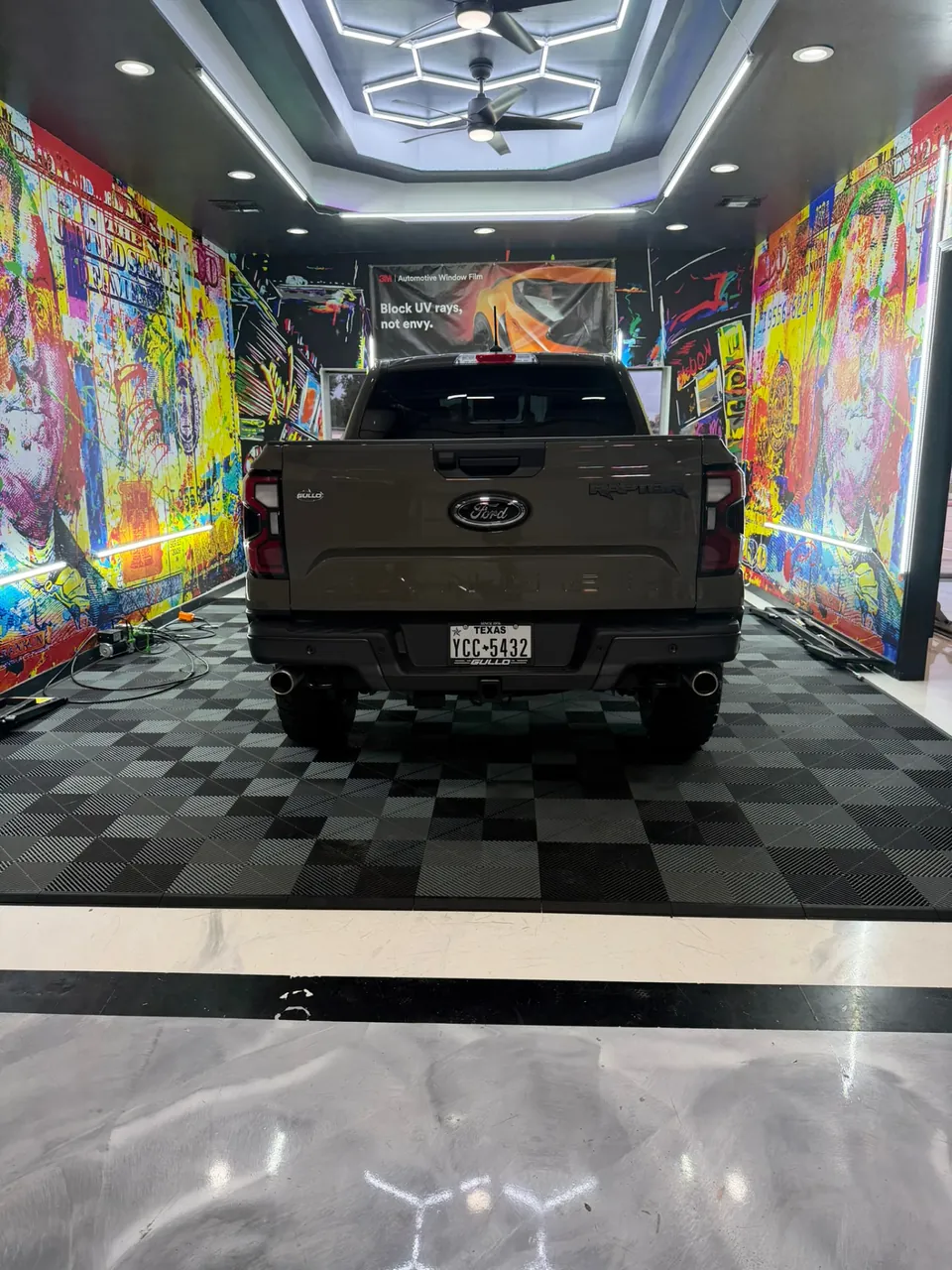 Ford Ranger Raptor with fresh window tint inside the LeWolf install bay in Magnolia, Texas