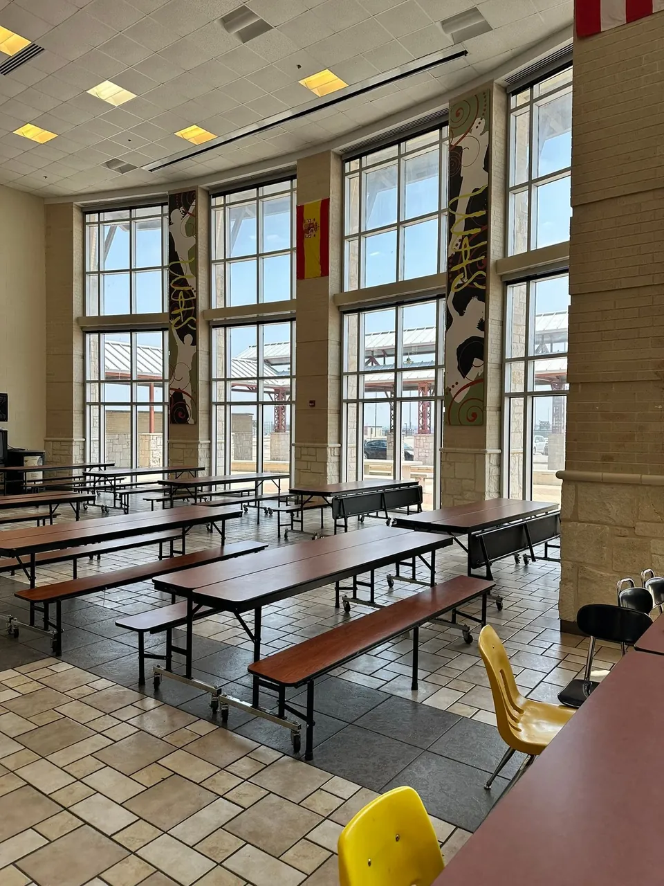 Two-story school commons glazing protected with safety and security film