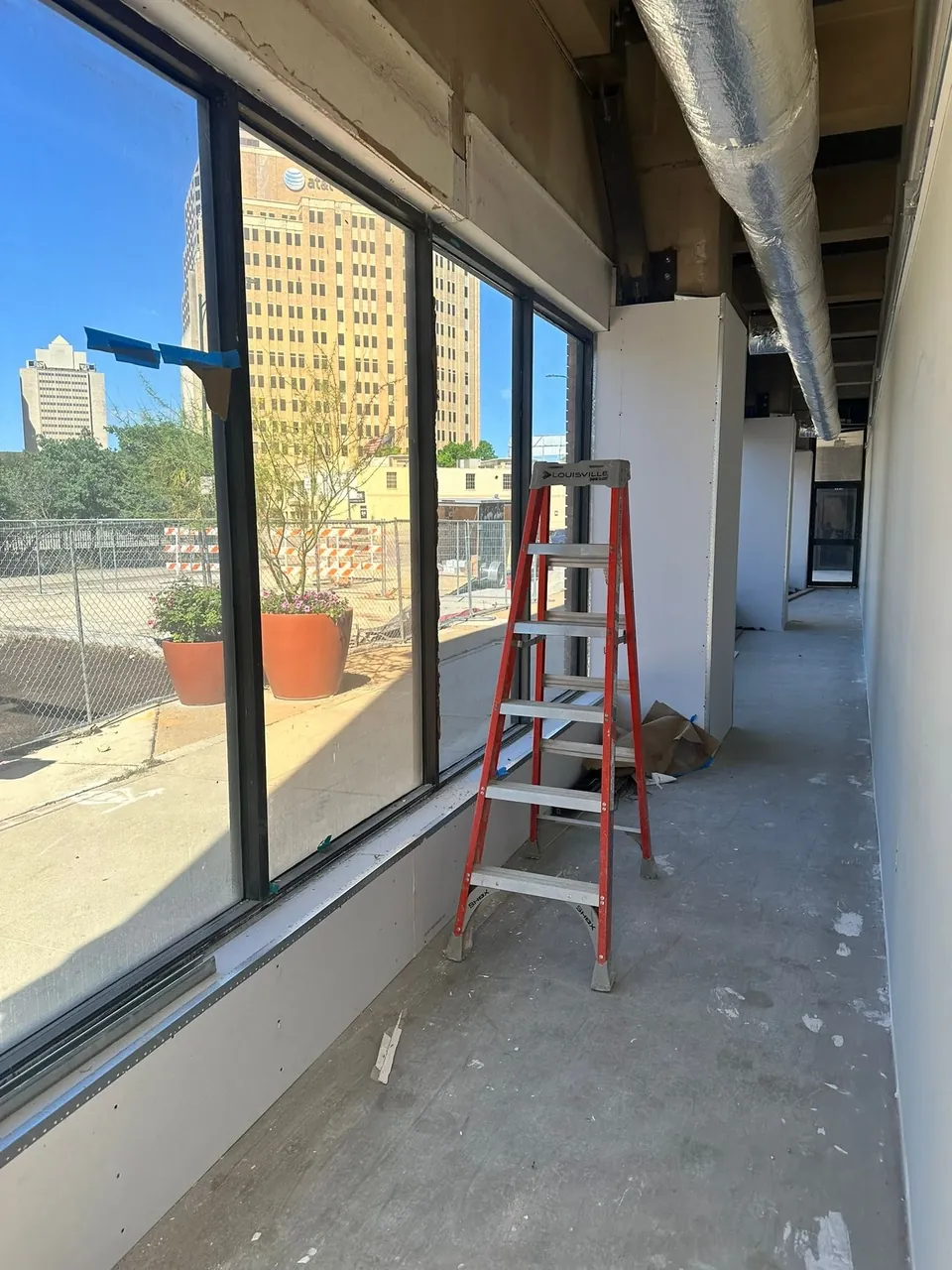 Safety and security window film installed on downtown office glass during a buildout